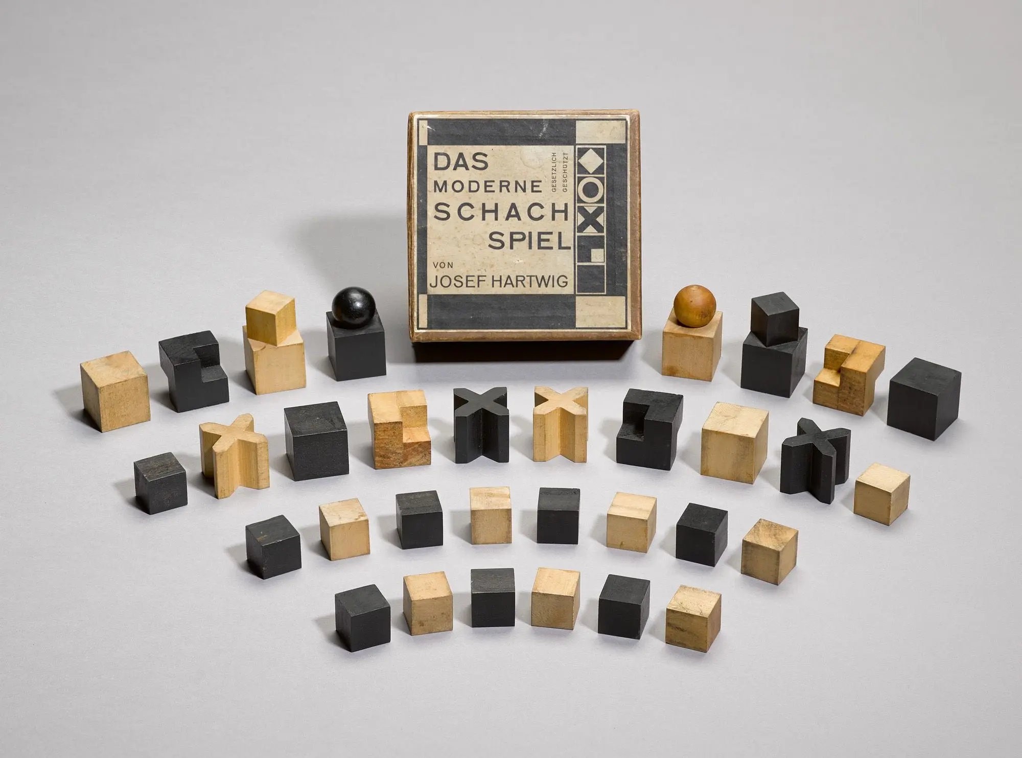Josef Hartwig's Bauhaus chess pieces — cubes, a cylinder and a sphere arranged as a set